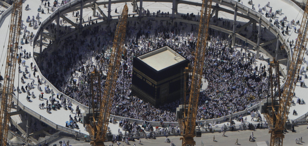 Cranes rise at the site of an expansion to the Grand Mosque as Muslim pilgrims circle counterclockwise around the Kaaba in Mecca, Saudi Arabia, in 2013.