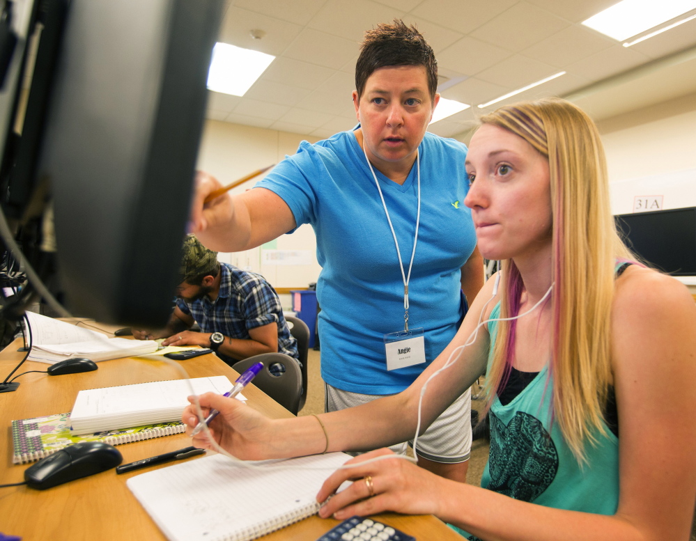 Tutor Angie Foster, center, helps student Krystal Huffman  at Big Bend Community College in Moses Lake, Wash., where learn-at-your-own-pace math classes are offered.