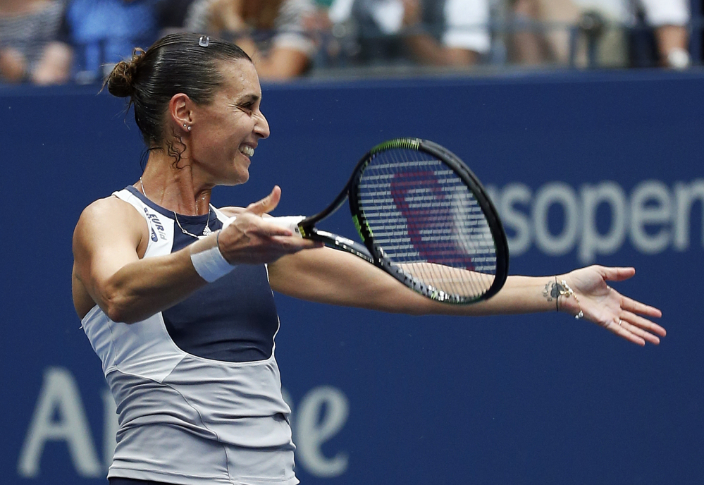 Flavia Pennetta, of Italy, reacts after beating Roberta Vinci, of Italy, during the women’s championship match of the U.S. Open tennis tournament on Saturday in New York.