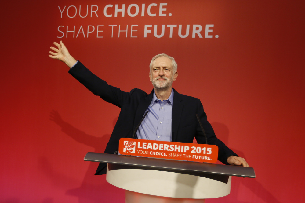 Jeremy Corbyn waves on stage after he is announced as the new leader of The Labour Party during the Labour Party Leadership Conference in London on Saturday. The Associated Press