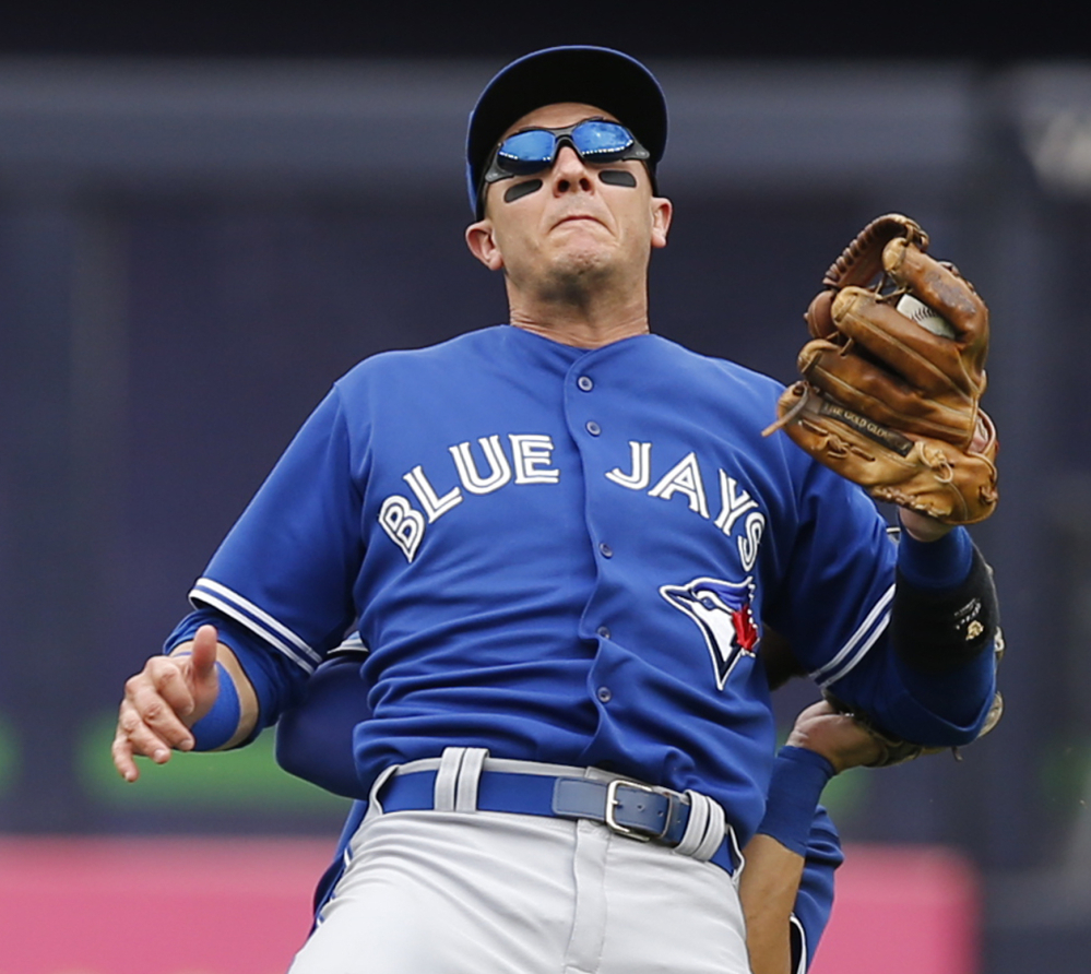 Blue Jays shortstop Troy Tulowitzki left the game with a cracked shoulder blade after colliding with center fielder Kevin Pillar on Saturday in New York.