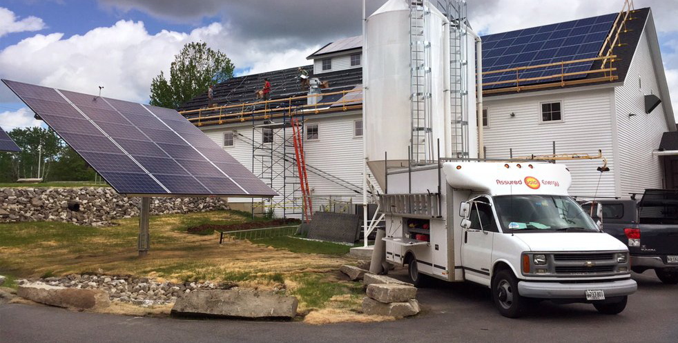 Assured Solar Energy installs a solar power array at the Maine Beer Co. in Freeport earlier this year.
