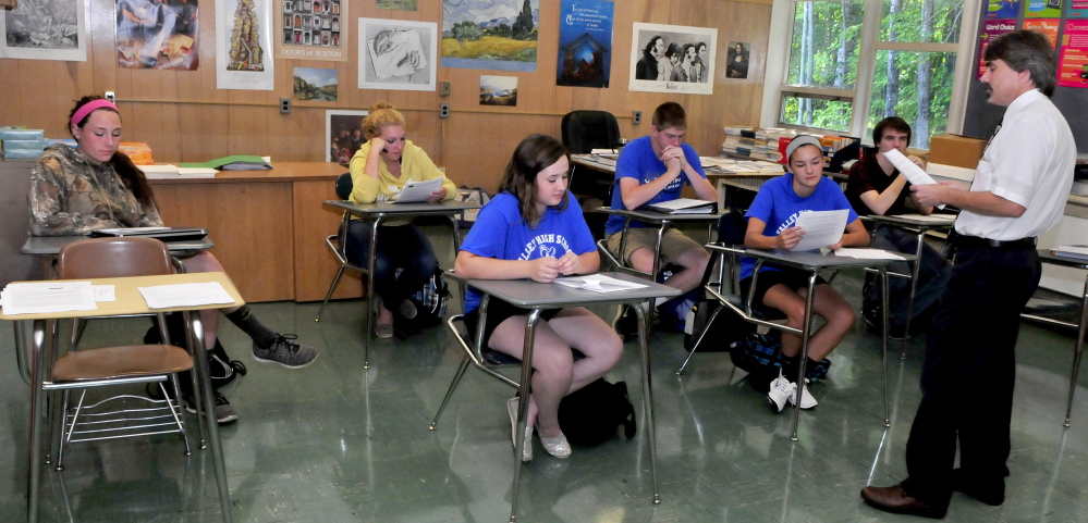 Upper Kennebec Valley Memorial High School teacher John Berube teaches at the Bingham school Wednesday. The school was ranked 175th out of 500 by Newsweek for its efforts to send low-income students to college.
