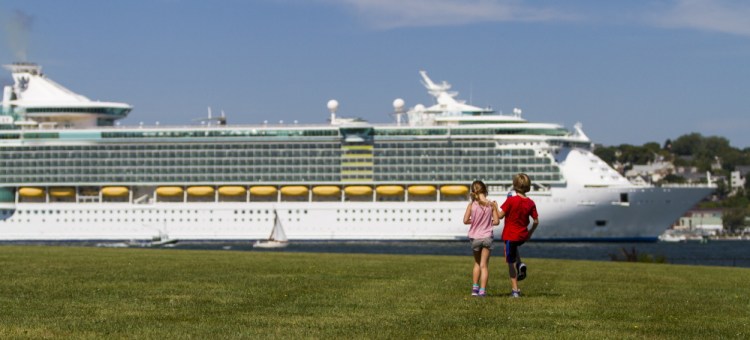 In this 2015 file photo, Audrey LeBleu of South Portland and Harry Converse of Cape Elizabeth take a look at the cruise ship Liberty of the Seas from Bug Light Park in South Portland.