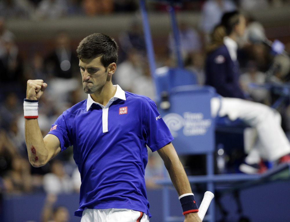 Novak Djokovic of Serbia clenches his fist while playing Roger Federer of Switzerland during the U.S. Open men’s final Sunday in New York.