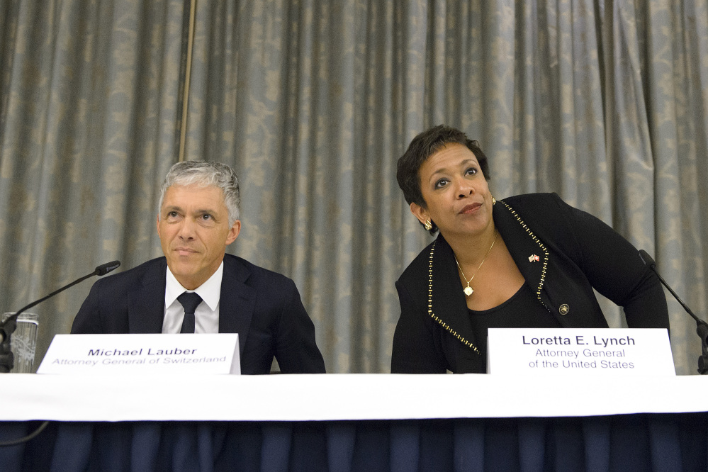 Michael Lauber, attorney general of Switzerland, and Loretta Lynch, U.S. attorney general, attend a news conference in Zurich on Monday.