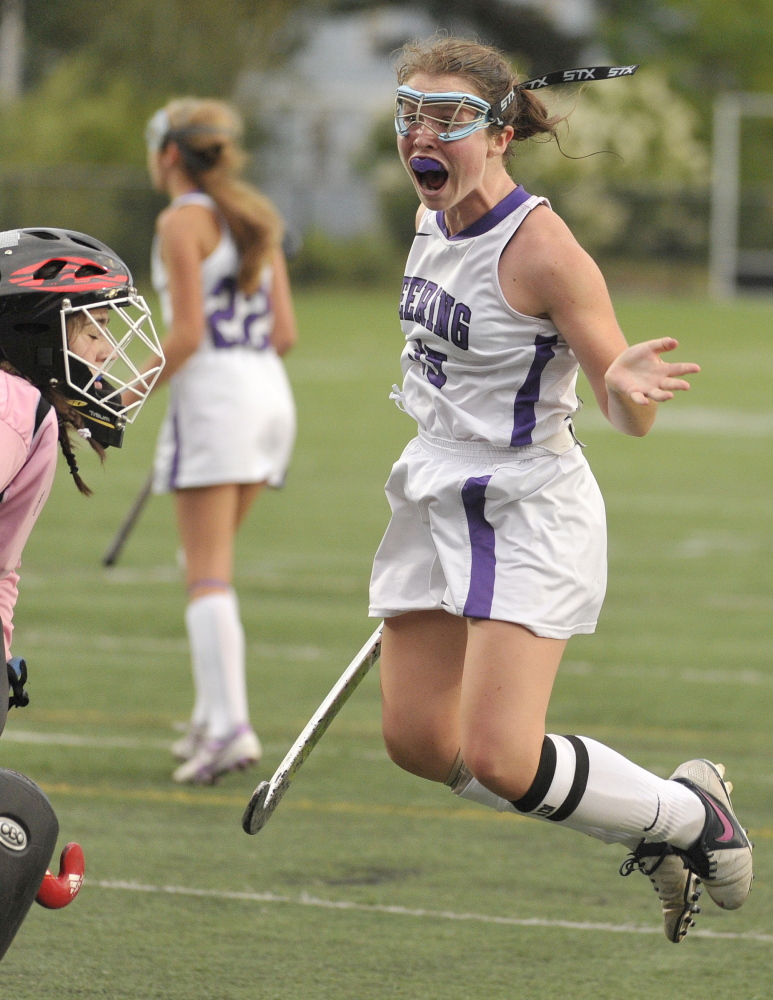 Kerry Wells of Deering celebrates after tying the game with 1:34 remaining Monday, but Portland came back to score the winning goal 11 seconds later.