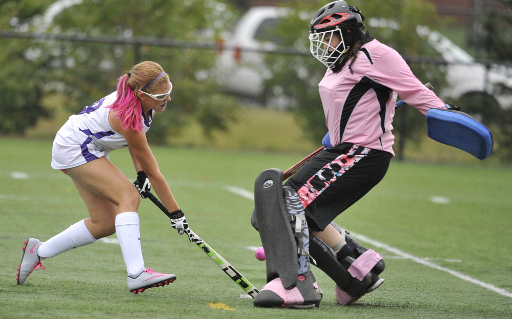 Gianna Gaudet, who played a splendid game in goal for Portland, blocks a scoring bid from Kaytlin DiBiase, who did score two goals for Deering.