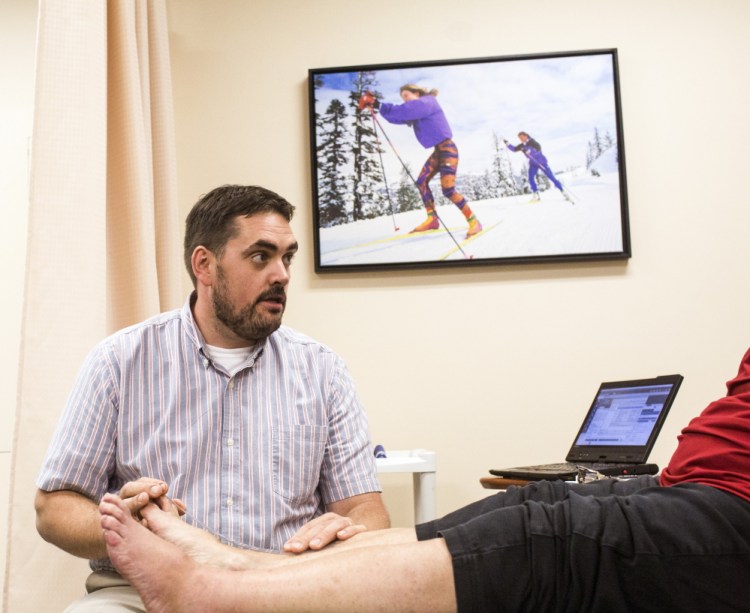 Physical Therapy Coordinator Todd Lamoreau works with a patient at InterMed in South Portland. Whitney Hayward/Staff Photographer