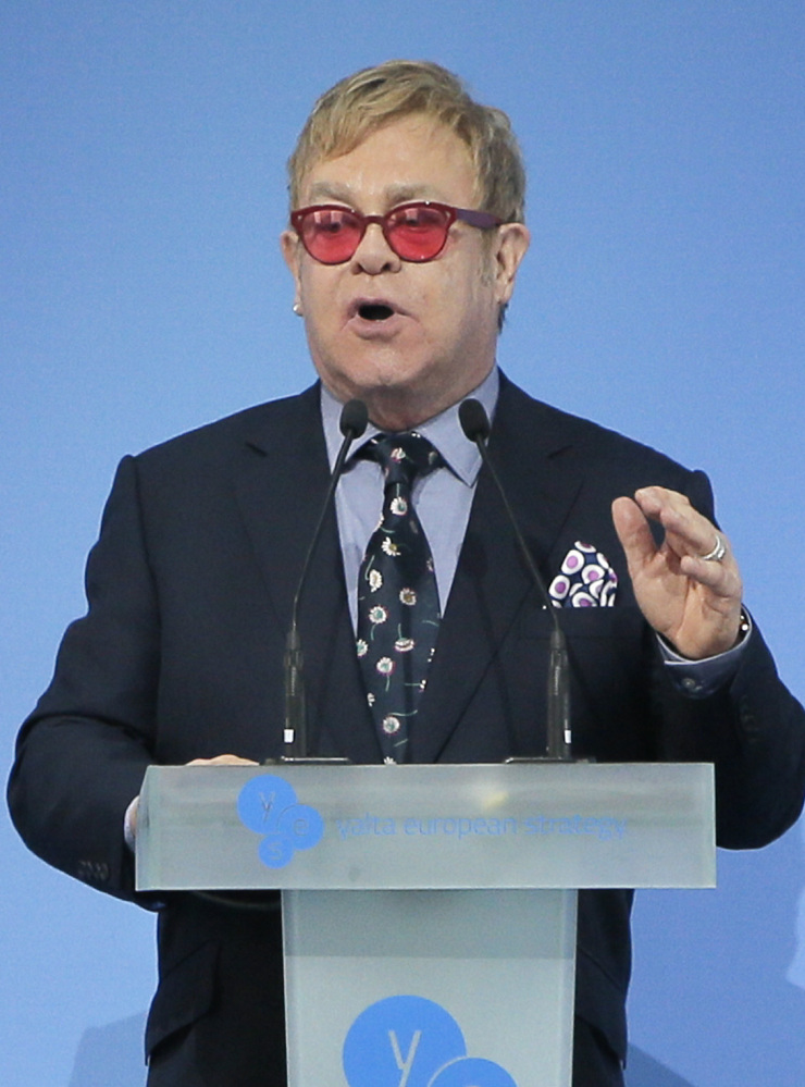 Sir Elton John speaking  during the 12th  Annual Meeting entitled “At Risk: How New Ukraine’s Fate Affects Europe and the World” organized by the Yalta European Strategy (YES) in partnership with the Victor Pinchuk Foundation at the Mystetsky Arsenal Art Center in Kiev, Ukraine, Saturday, Sept. 12, 2015. Sir Elton John delivered a keynote speech  about the role of business in promoting human rights.  More than 200 leaders from politics, business and society representing more than 20 countries will discuss major global challenges and their impact on Europe, Ukraine and the world. (AP Photo/Efrem Lukatsky)