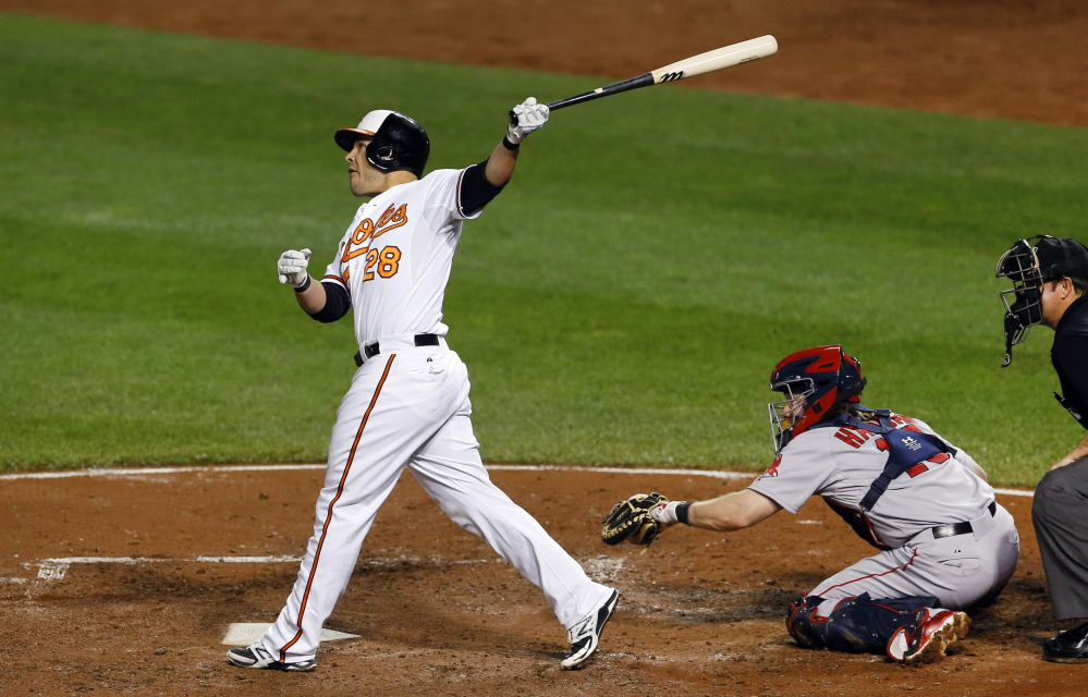 The Orioles’ Steve Pearce watches his two-run home run in the third inning. The game went 10 more innings before Baltimore won, 6-5.