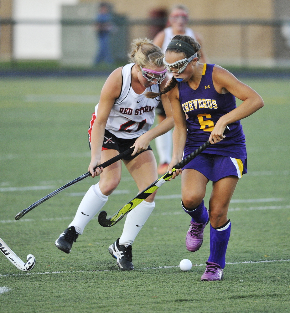 Scarborough’s Ashley Levesque, left, and Cheverus’ Sophia Pompeo, battle for control of the ball in Wednesday’s field hockey game at Scarborough. The Stags held on for a 2-1 win.
