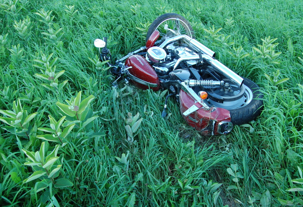 The Harley-Davidson ridden by Jonathan Billings of Windham lies in the field in New Sharon where Billings crashed in August. Police said Billings, 24, was speeding and not wearing a helmet when his motorcycle left the road and hit a fence post off Route 27.