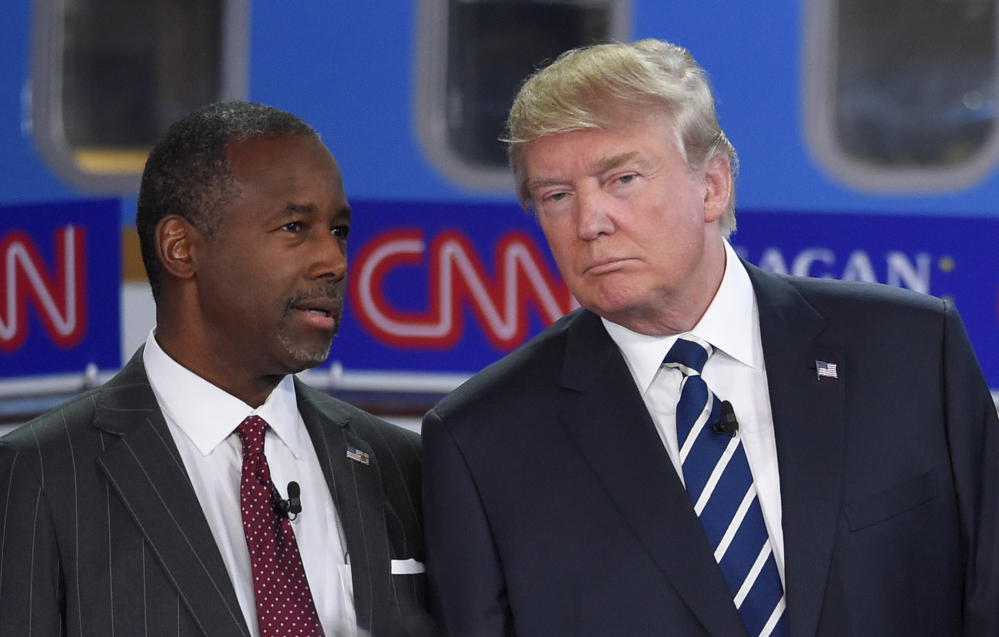 Ben Carson, left, who recently abandoned his bid for the Republican presidential nomination, is planning to endorse Donald Trump on Friday, the Washington Post reports. 