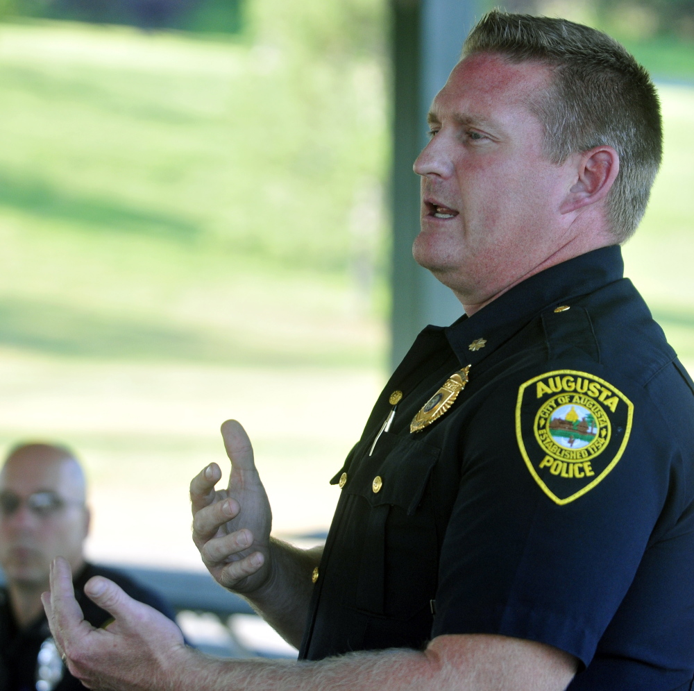 Augusta police Deputy Chief Jared Mills speaks during a public meeting Thursday in the Mill Park gazebo at the base of Sand Hill in Augusta.