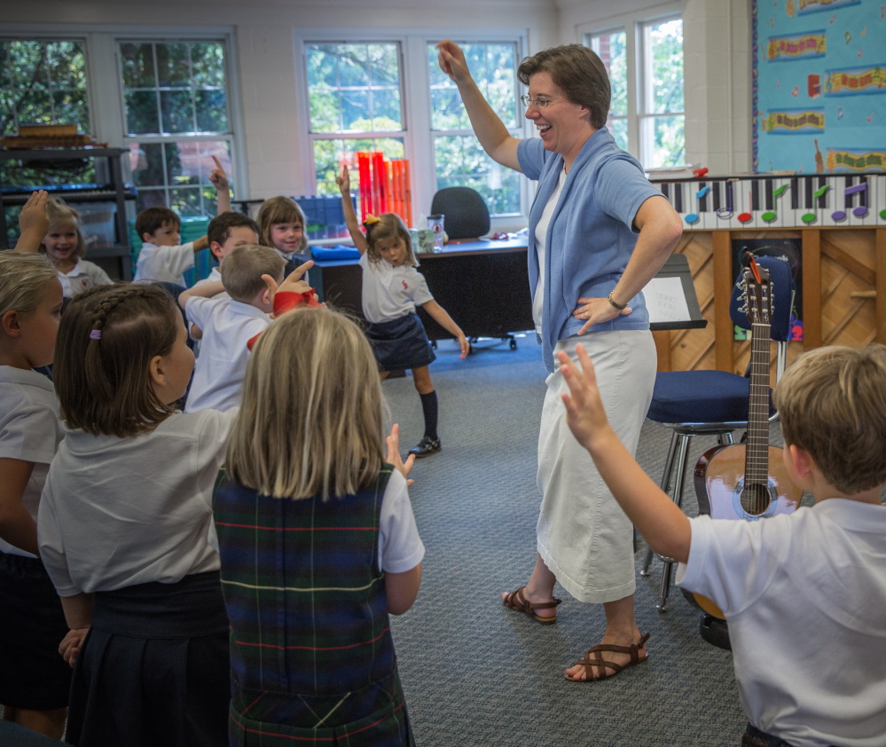 Sister Rachel leads her kindergarten students in a religious version of the 2007 pop hit “Cupid Shuffle” at Little Flower Catholic School outside Washington, D.C., on Friday.