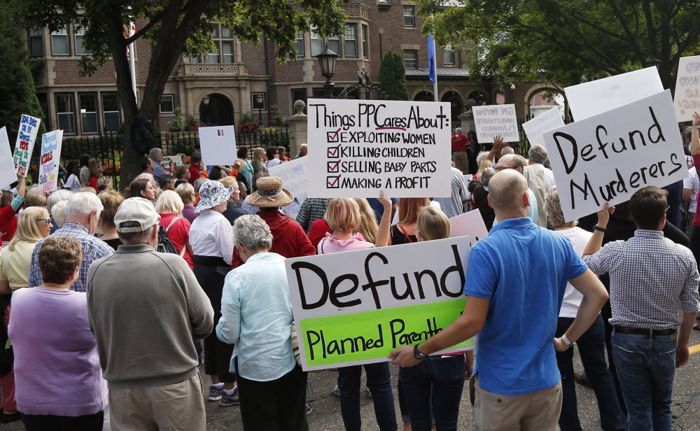 Planned Parenthood protests, like this one in St. Paul, Minn., have been helping an effort in Congress to shut down funding to Planned Parenthood. A House bill would bar federal funds unless the Planned Parenthood organization certifies that it will not perform abortions.