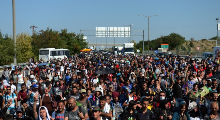 Hundreds of migrants march down a highway toward Turkey’s western border with Greece and Bulgaria, near Edirne, Turkey, on Friday.