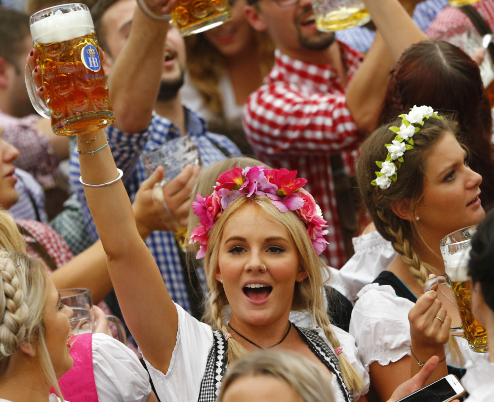 A young woman celebrates the opening of the 182nd Oktoberfest on Saturday in Munich, Germany. Some 6 million visitors are expected at the beer festival through Oct. 4.