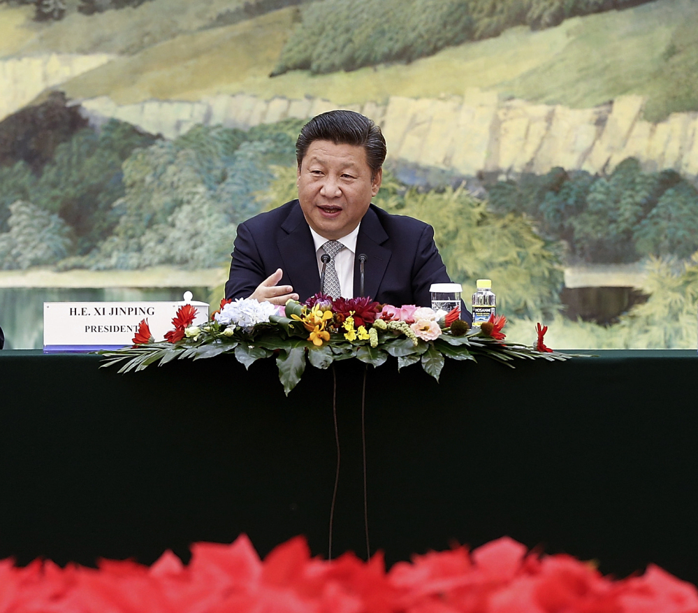 Chinese President Xi Jinping speaks at a meeting with U.S. business leaders Thursday in Beijing. He and President Obama are expected to discuss several hot-button topics.