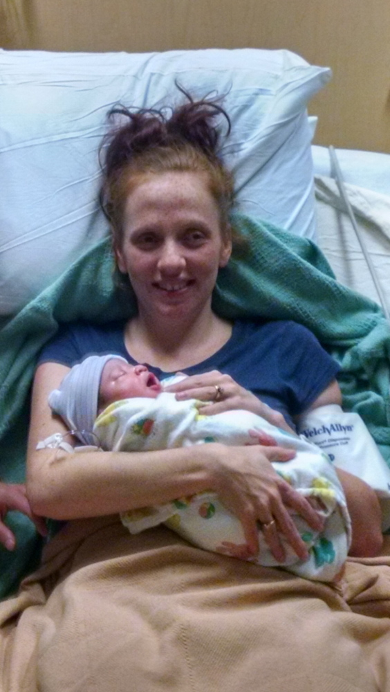 Alice Ingalls, 25, holds her baby girl Saturday at MaineGeneral Medical Center in Augusta. Ingalls gave birth off to the side of Route 3 before 4 a.m. Saturday.