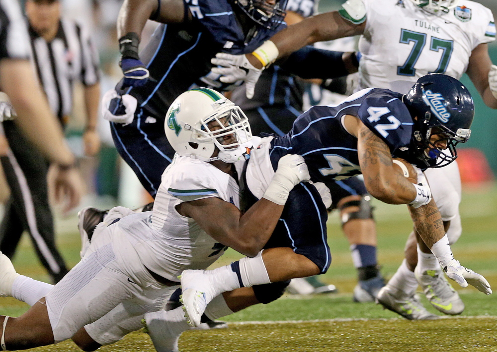 Tulane defensive end Royce LaFrance (48) drops Maine running back Darian Davis-Ray (42) for a loss during the second quarter Saturday in New Orleans.