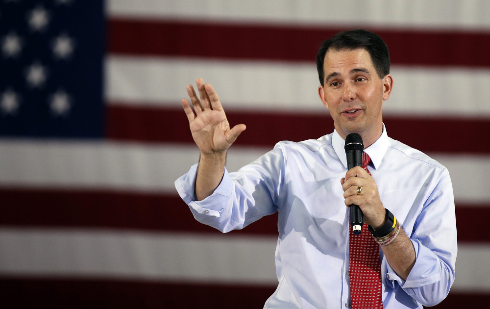 Republican presidential candidate Wisconsin Gov. Scott Walker tried to cast himself as an unintimidated conservative fighter who had a record of victories in a state that hasn’t voted Republican for president since 1984.