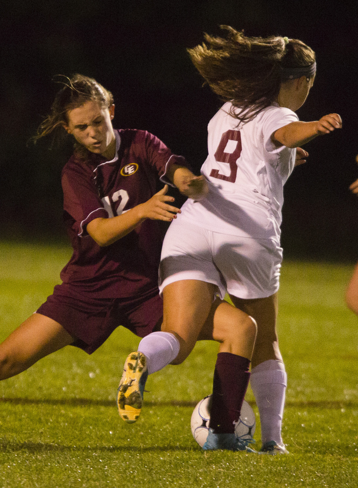 Cape Elizabeth’s Grace Gillian steps in to play the ball in front of Greely’s Elli Schad during the Rangers’ 1-0 win Monday in Cumberland. Schad scored the lone goal of the game in the second half.