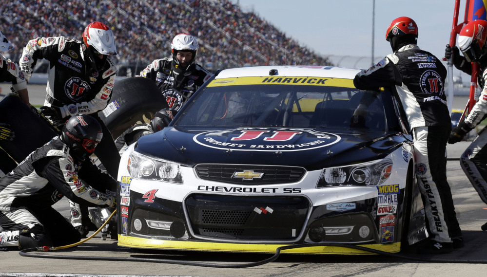 Kevin Harvick, seen making a pit stop during the Sprint Cup race Sunday at Chicagoland Speedway, could help himself by settling a dust-up with longtime friend Jimmie Johnson.