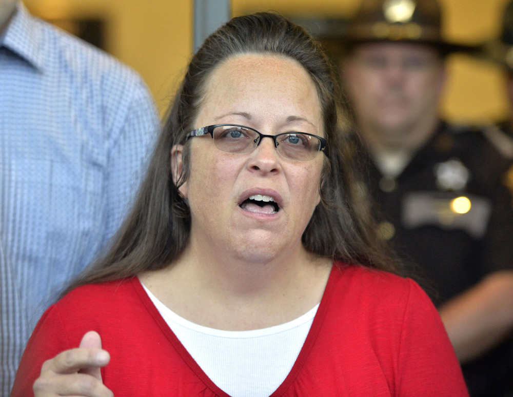 In this file photo Rowan County Clerk Kim Davis makes a statement to the media at the front door of the Rowan County Judicial Center in Morehead, Ky.,on Sept. 14.