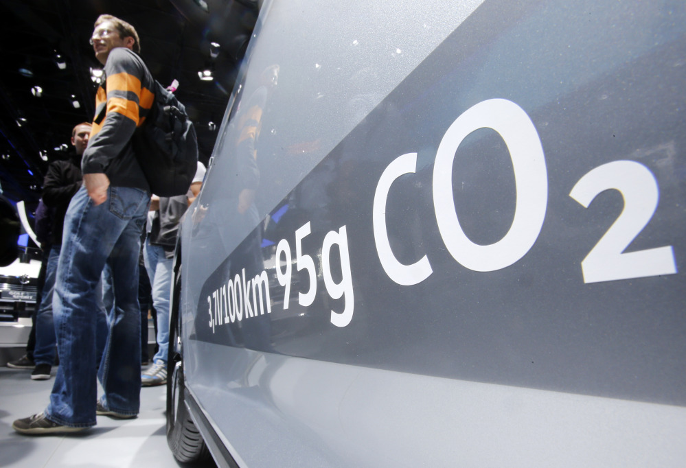 The amount of carbon dioxide emission is written on a Volkswagen Passat Diesel at the Frankfurt Car Show in Frankfurt, Germany, Tuesday, Sept. 22, 2015.