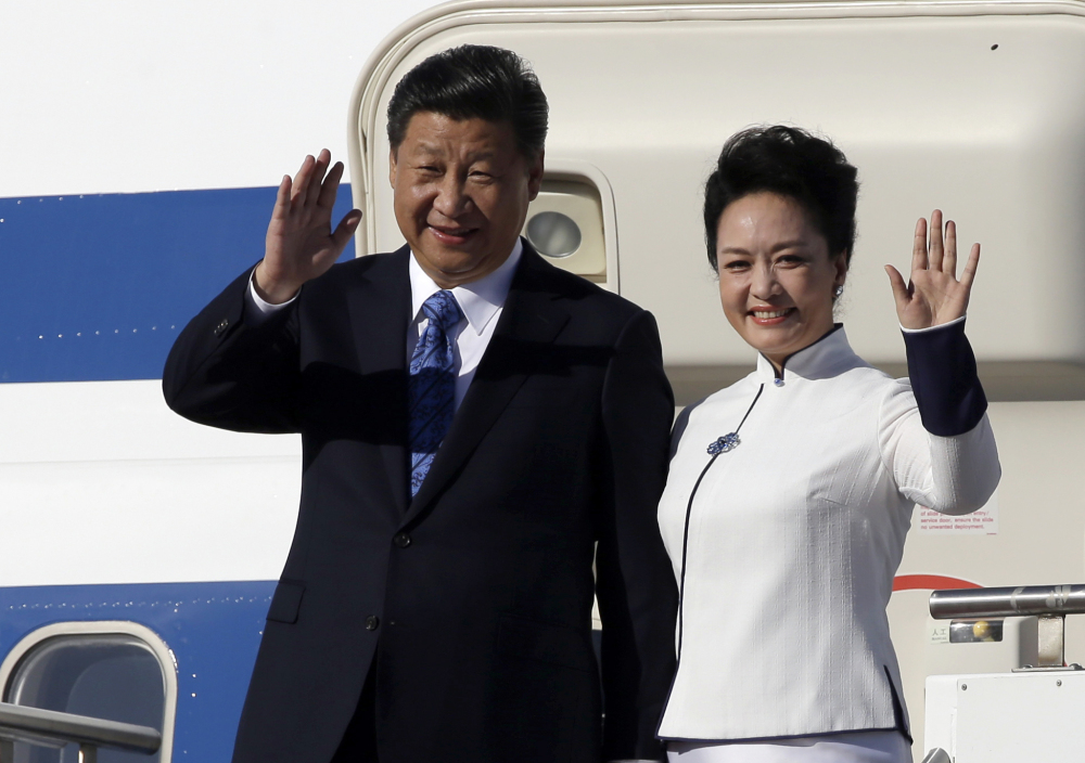 Chinese President Xi Jinping and his wife, Peng Liyuan, arrive Tuesday at Boeing Field in Everett, Wash. Xi is spending three days in Seattle before traveling to Washington, D.C., for a White House state dinner on Friday.