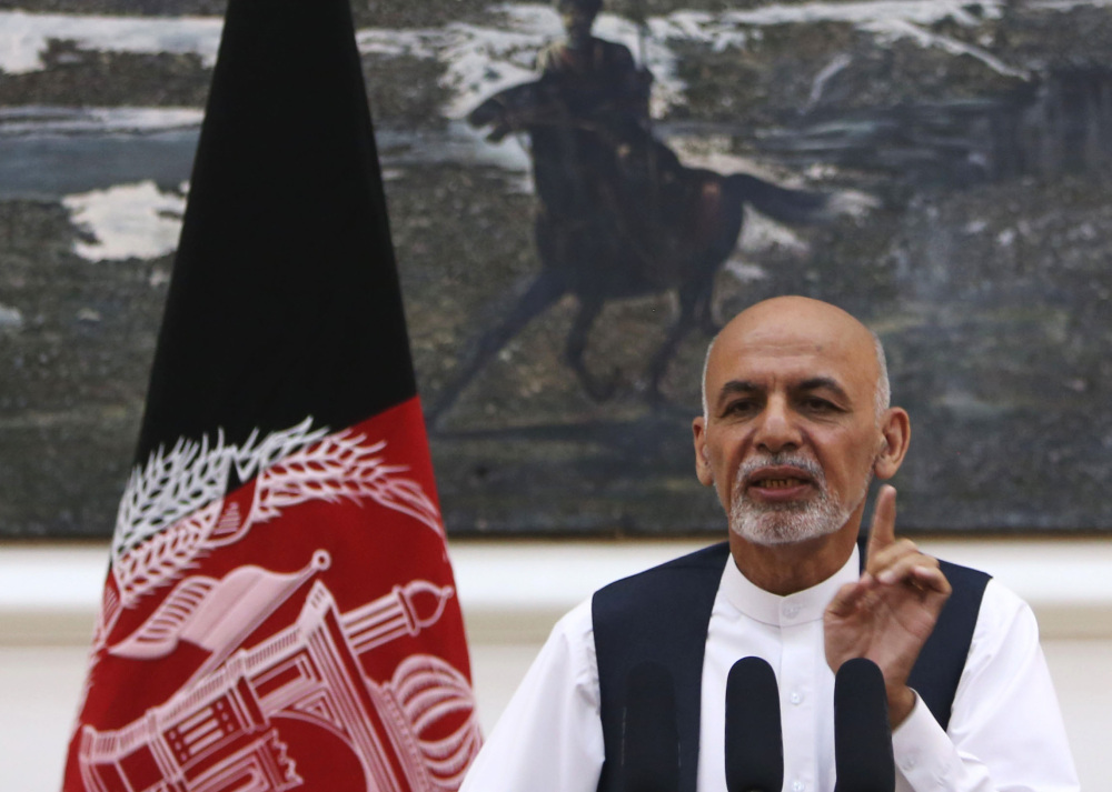 Afghan President Ashraf Ghani speaks at a conference Monday. In the single year since he came to power, applications for passports are up sevenfold.