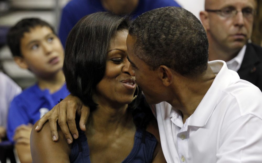 President Obama and first lady Michelle Obama were willing to oblige a kiss cam at a basketball game in 2012 in Washington.