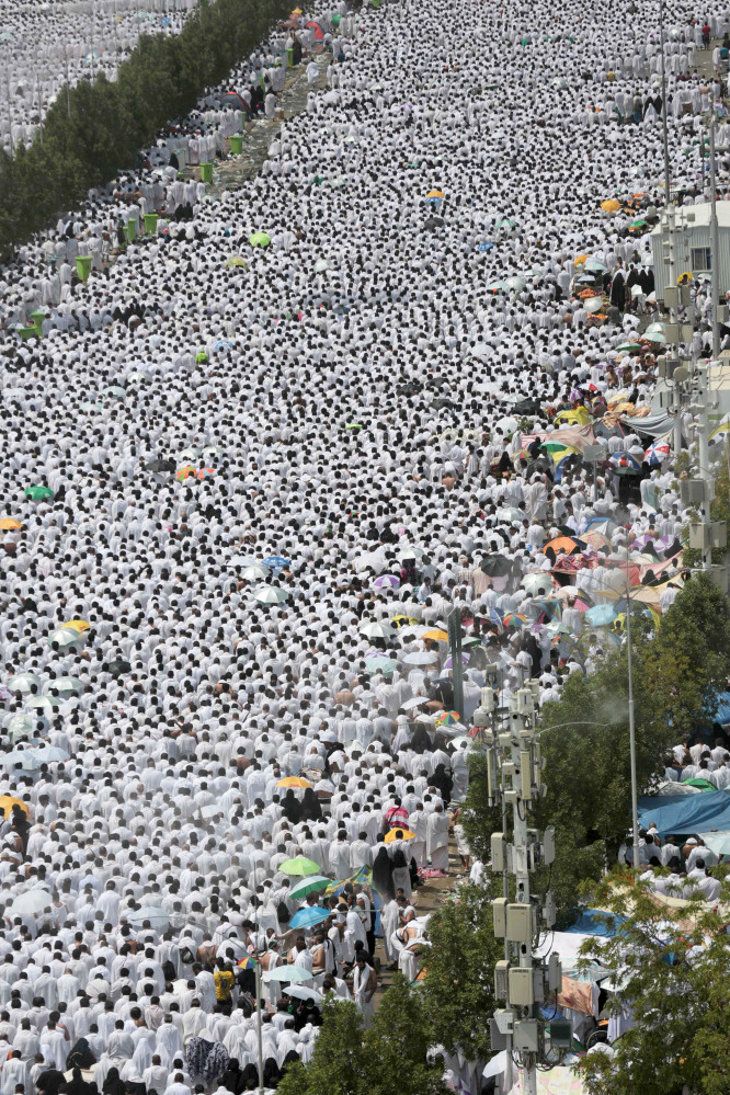 Hundreds of thousands of Muslim pilgrims pray outside Namira mosque in Arafat, on the second and most significant day of the annual hajj pilgrimage, near the holy city of Mecca, Saudi Arabia, on Wednesday.