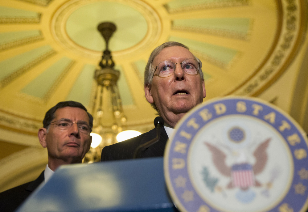 Senate Majority Leader Mitch McConnell has offered a bipartisan stopgap bill free of the Planned Parenthood issue that’s expected to clear the Senate next week. In the background is Wyoming Republican John Barrasso.