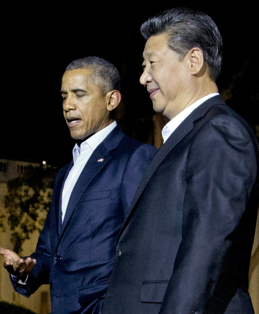 President Obama and Chinese President Xi Jinping, right, stroll outside the White House on Thursday.
