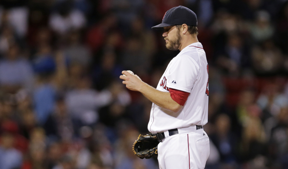 Red Sox starter Wade Miley looks at a new baseball as he waits for Tampa Bay’s Kevin Kiermaier to round the bases on a solo home run in the seventh inning Thursday night. Miley took the loss and fell to 11-11 on the season.
