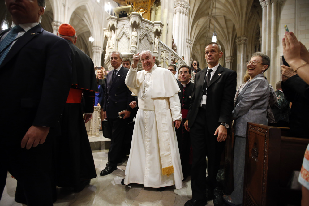Pope Francis gives a thumbs up after leading an evening prayer service at St. Patrick’s Cathedral in New York on Thursday. The pontiff has the wisdom to avoid creating unnecessary wedges, a letter writer says.