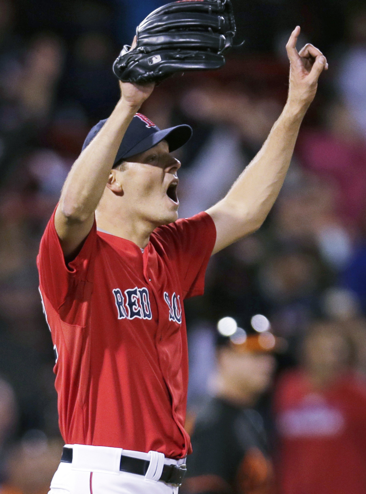 Red Sox starting pitcher Rich Hill reacts to right fielder Mookie Betts’ spectacular catch at the bullpen wall for the final out of the ninth inning, preserving Hill’s shutout against the Baltimore Orioles.