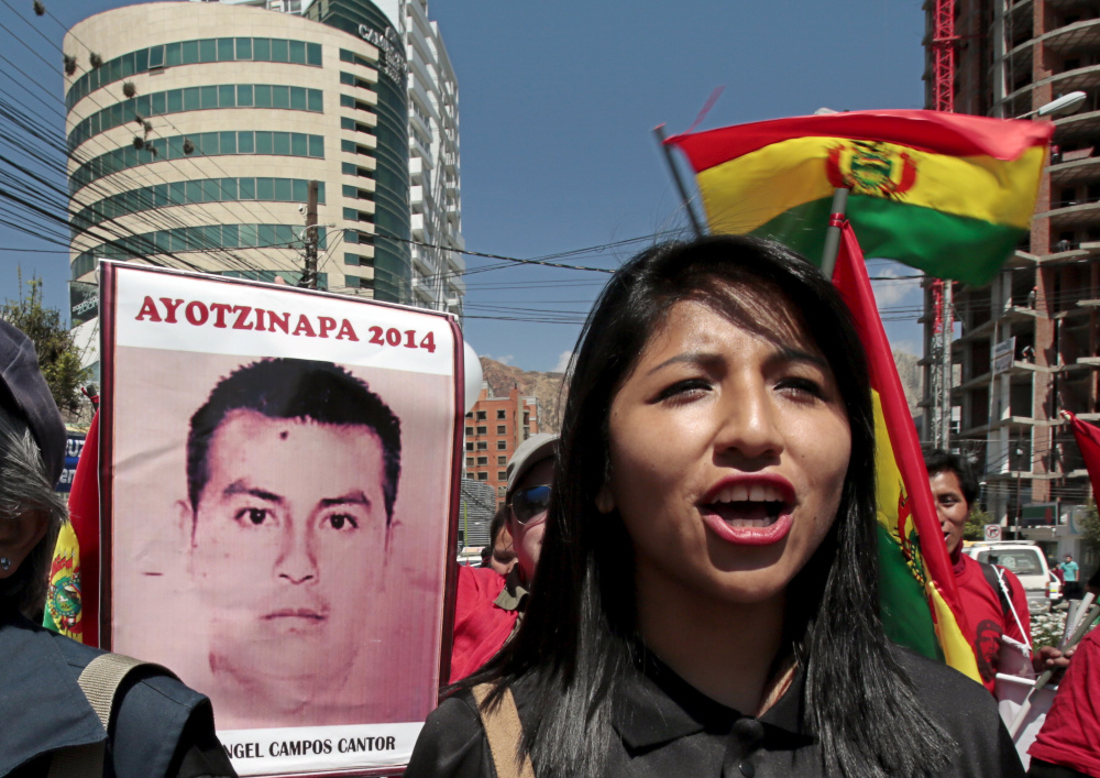 Eva Liz Morales, daughter of Bolivia’s President Evo Morales, takes part in a Saturday protest in La Paz, Bolivia, about the 43 Mexican students who disappeared a year ago.