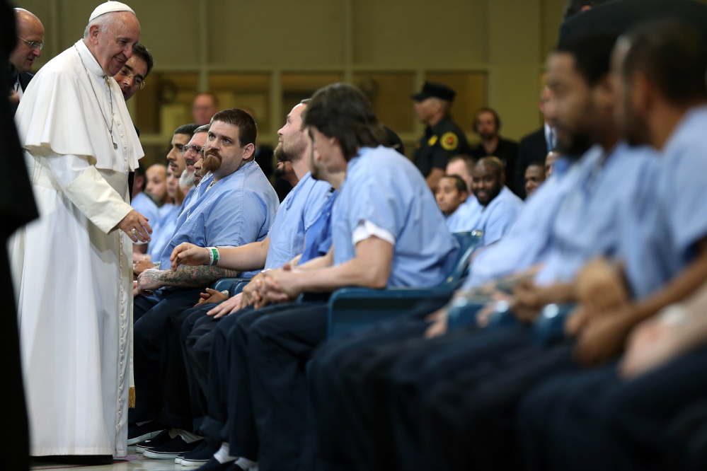 Pope Francis greets inmates during his visit to Curran Fromhold Correctional Facility in Philadelphia on Sunday.