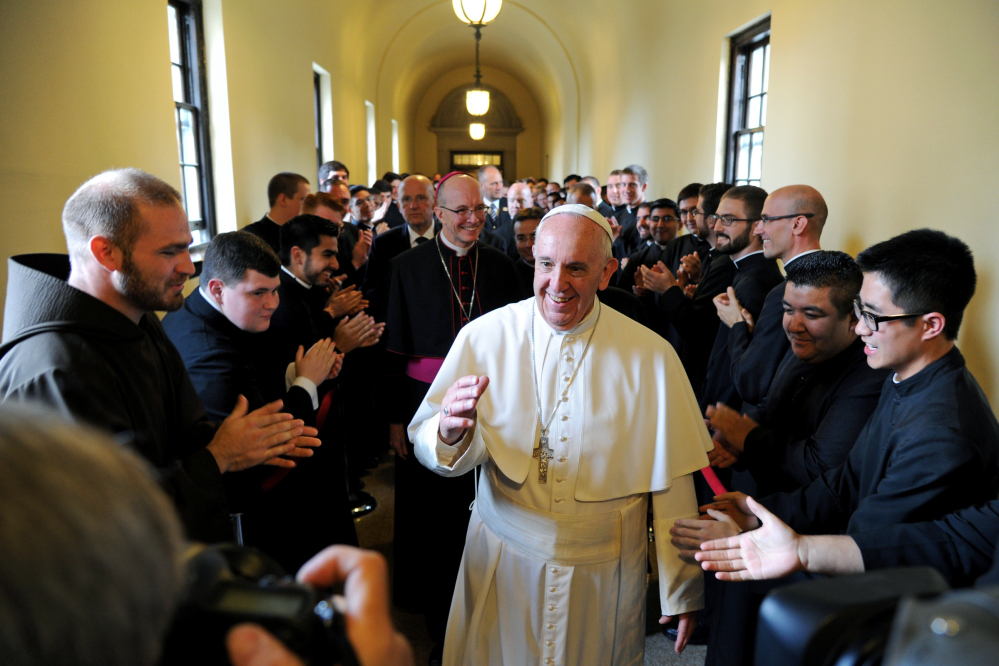 In this file photo, Pope Francis greets seminarians as he walks the loggia to his address to the Bishops at St. Martin of Tours Chapel at St.Charles Borromeo Seminary in Wynnewood, Pennsylvania.