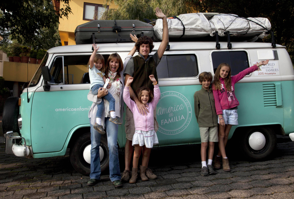 Catire Walker, center, Noel Zemborain, left, and their children, from left, Carmin, Mia, Dimas and Cala pose in front of their 1980 Volkswagen van, which they named Francisca. The family piled into the van in March in Buenos Aires, Argentina, traveling 13,000 miles to see Pope Francis in Philadelphia and attend the Festival of Families.