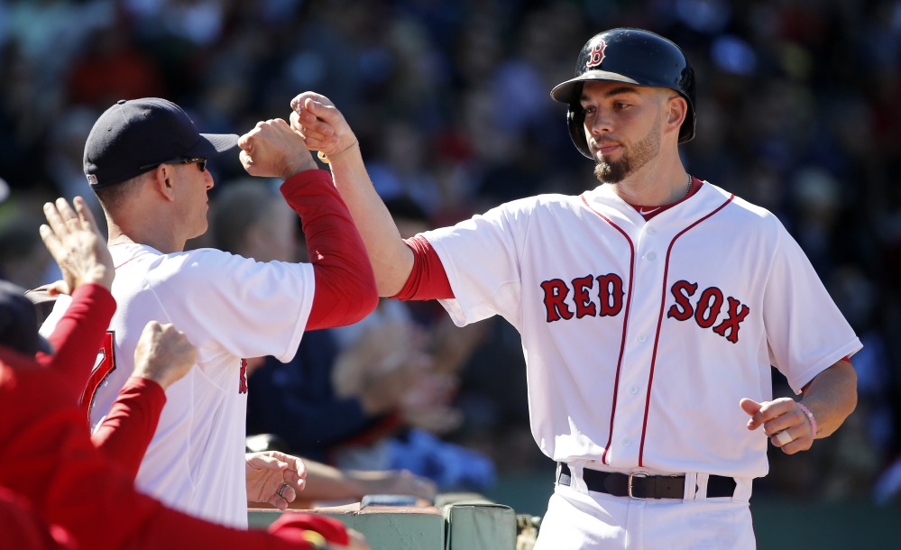 Blake Swihart, right, celebrates his solo home run with interim manager Torey Lovullo during the third inning of Sunday’s game at Fenway Park. The Red Sox shut out the Orioles, 2-0.