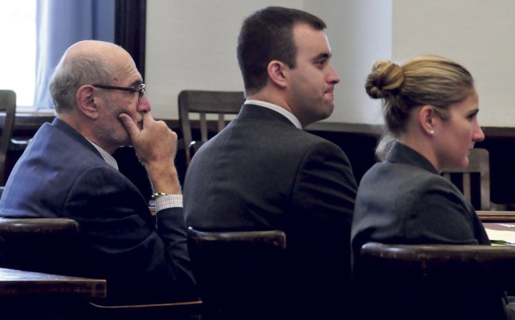 Andrew Maderios, center, and his attorneys Leonard Sharon and Caleigh Milton, listen to the victim make statements at Maderios’ sentencing hearing Monday in Somerset County Superior Court.