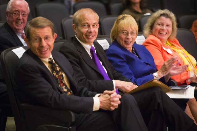 Maine Turnpike Authority Executive Director Peter Mills, left, sits with his brother Paul Mills, a Farmington lawyer and history expert, and his sisters Janet Mills, Maine’s attorney general, and Dora Anne Mills, former state public health director, at USM’s Portland campus Monday night. They received the Maine History Maker Award from the Maine Historical Society.
