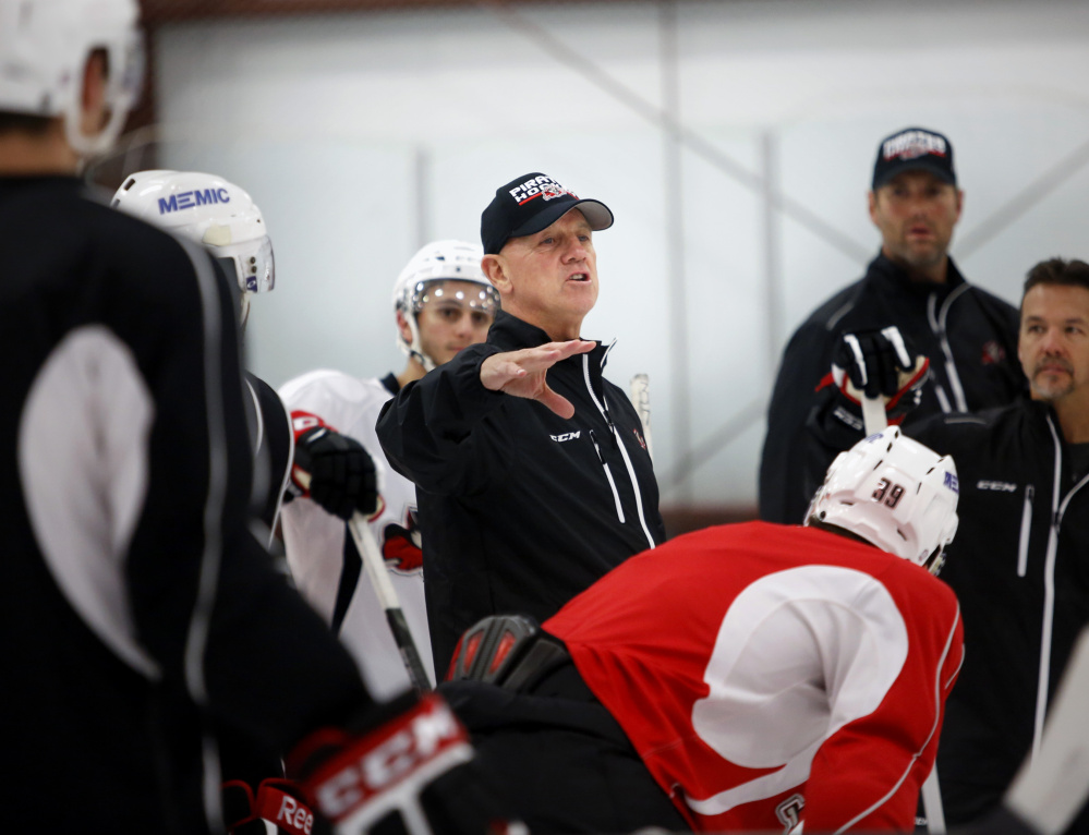 Coach Tom Rowe talks to his team during the first practice of the season for the Portland Pirates on Tuesday in Saco. The Pirates are beginning their first season as an affiliate of the NHL’s Florida Panthers.
Derek Davis/Staff Photographer