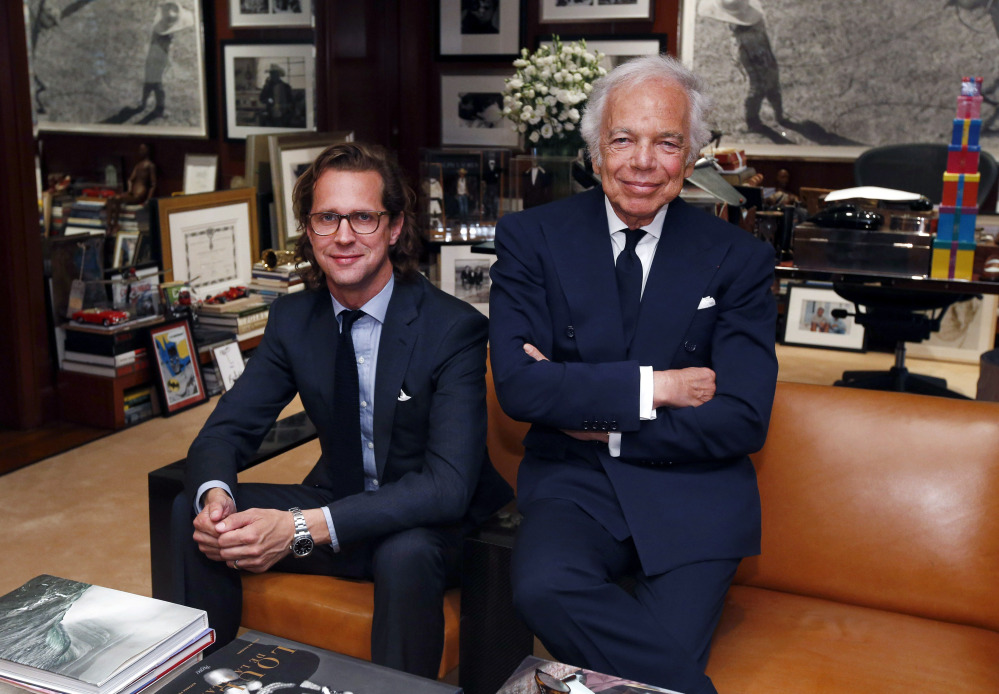 In his midtown Manhattan office, fashion designer Ralph Lauren, right, emphasized that stepping down as CEO does not mean he’s slowing down, and said he sees incoming CEO Stefan Larsson, left, as a partner in spearheading future sales growth.