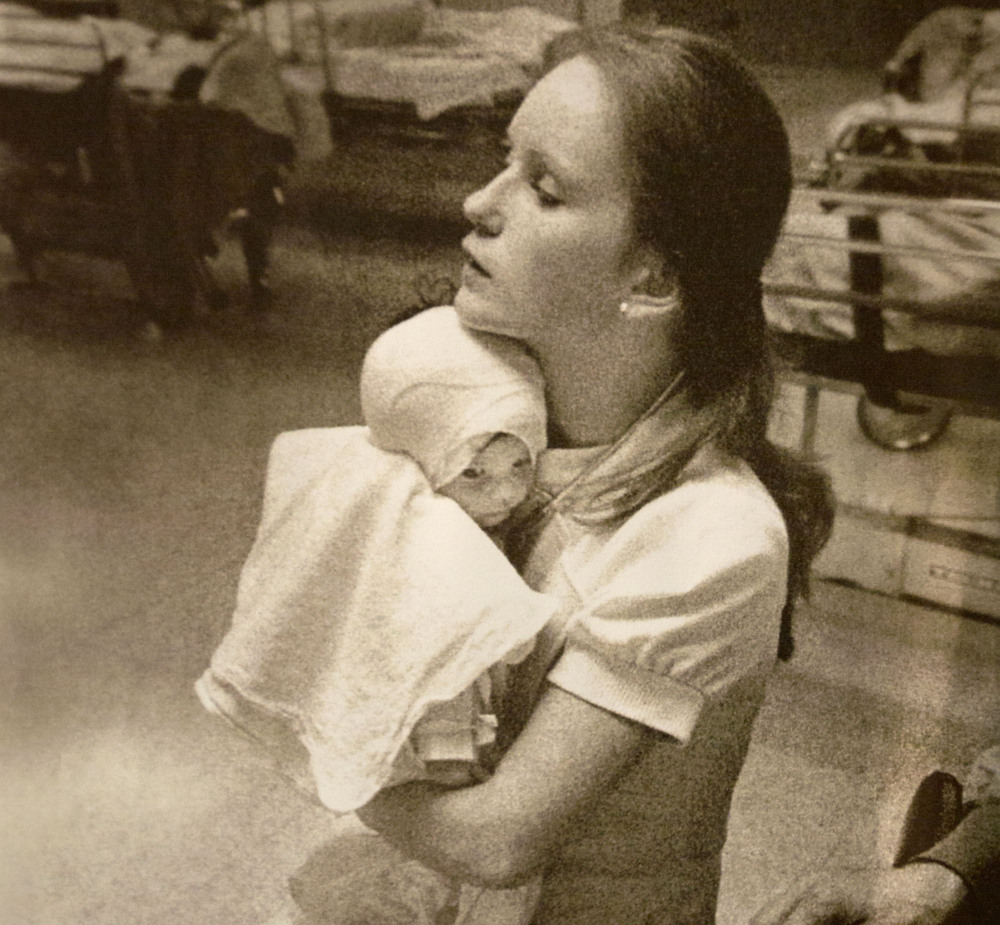 Susan Berger holds Amanda Scarpinati in a 1977 photo. 